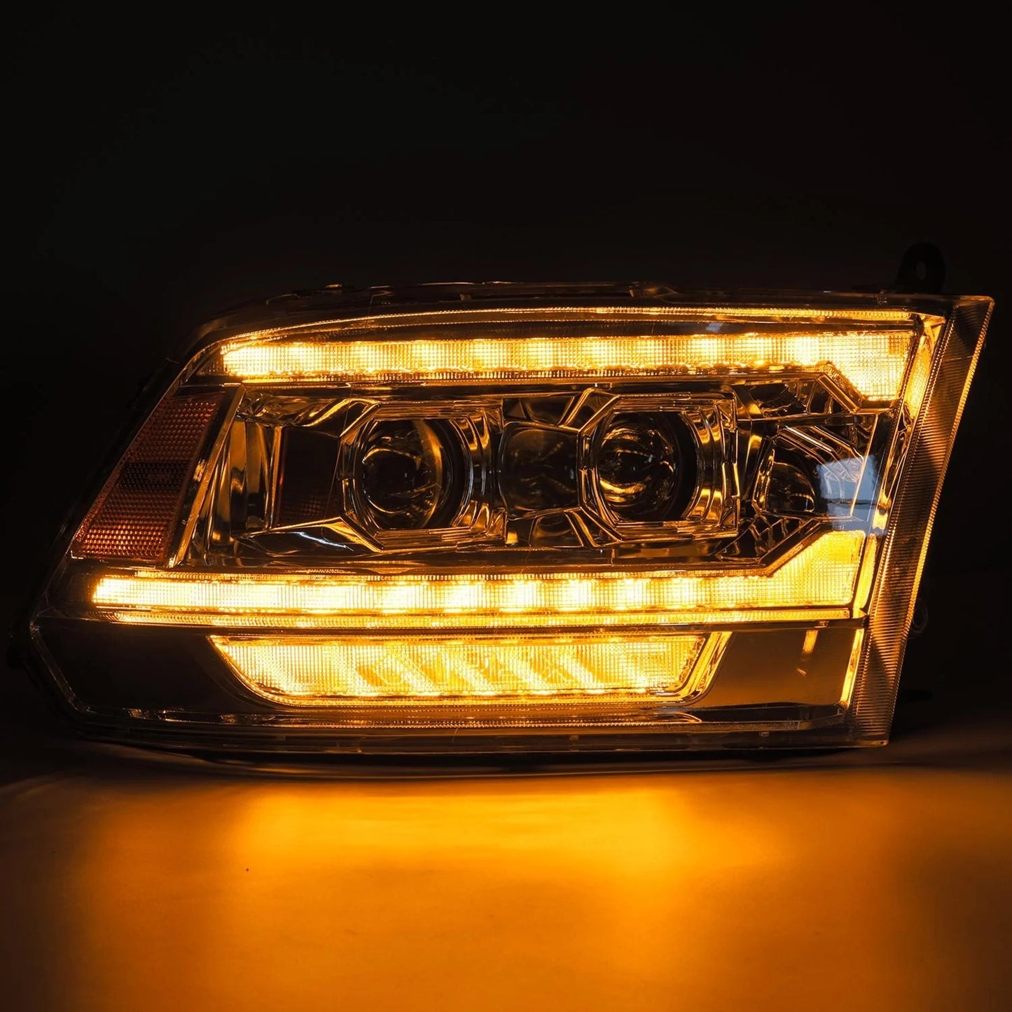 AlphaRex Chrome Plank Style Halogen Projector Headlights w/ Sequential Signal & Top Middle DRL for 2009-2018 Ram 1500 & 2019-2024 Ram 1500 Classic (SKU ARX880562 / AHL-DR09-G5-P-S-C)