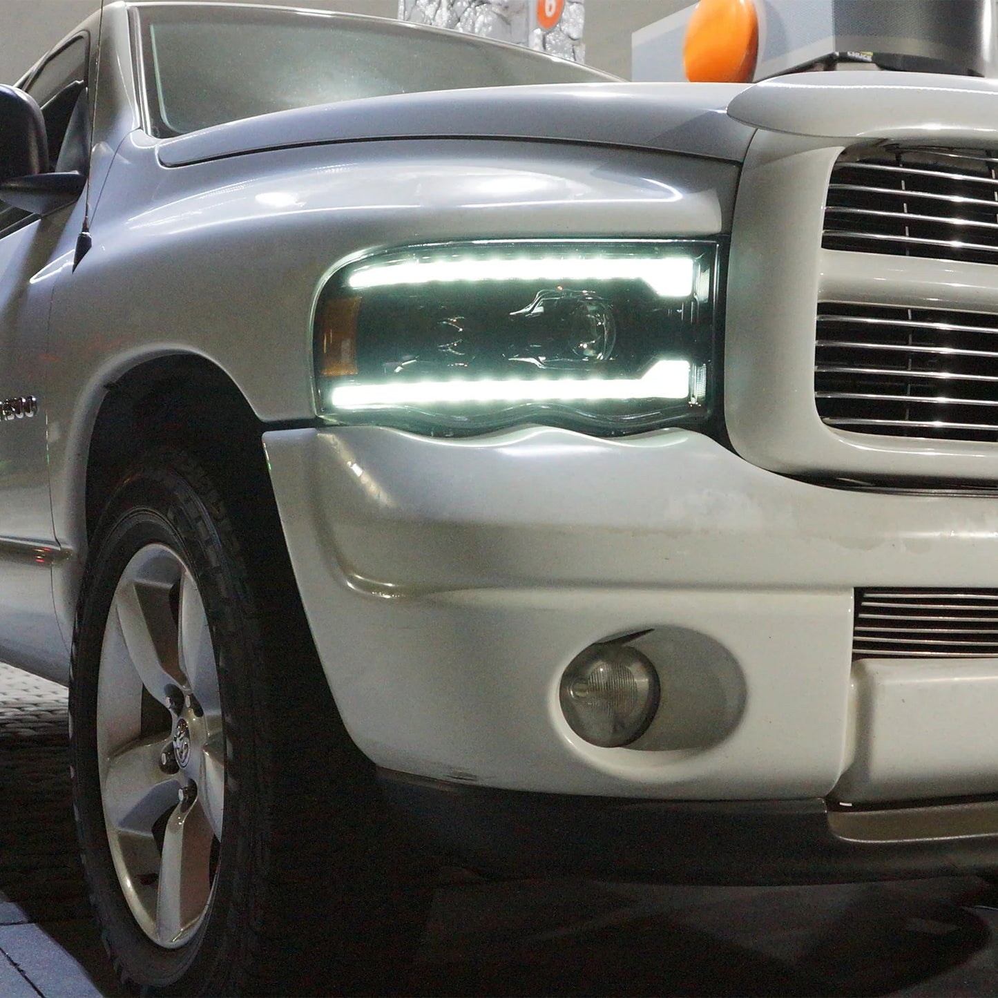 AlphaRex Alpha-Black Projector Headlights w/ Sequential Signal & DRL for 2002-2005 Dodge Ram 1500 & 2003-2005 Dodge Ram 2500/3500 (SKU ARX880572 / AHL-DR02-P-S-FLB)