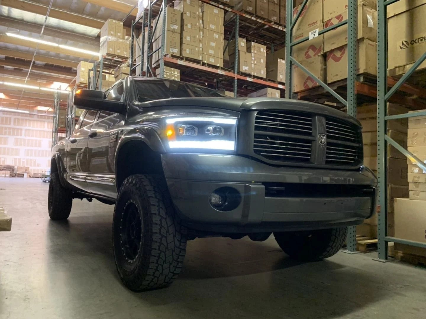 AlphaRex Black Plank Style Halogen Projector Headlights w/ Sequential Signal Top Bottom DRL for 2006-2009 Dodge Ram 1500/2500/3500 (SKU ARX880532 / AHL-DR06-P-S-B)