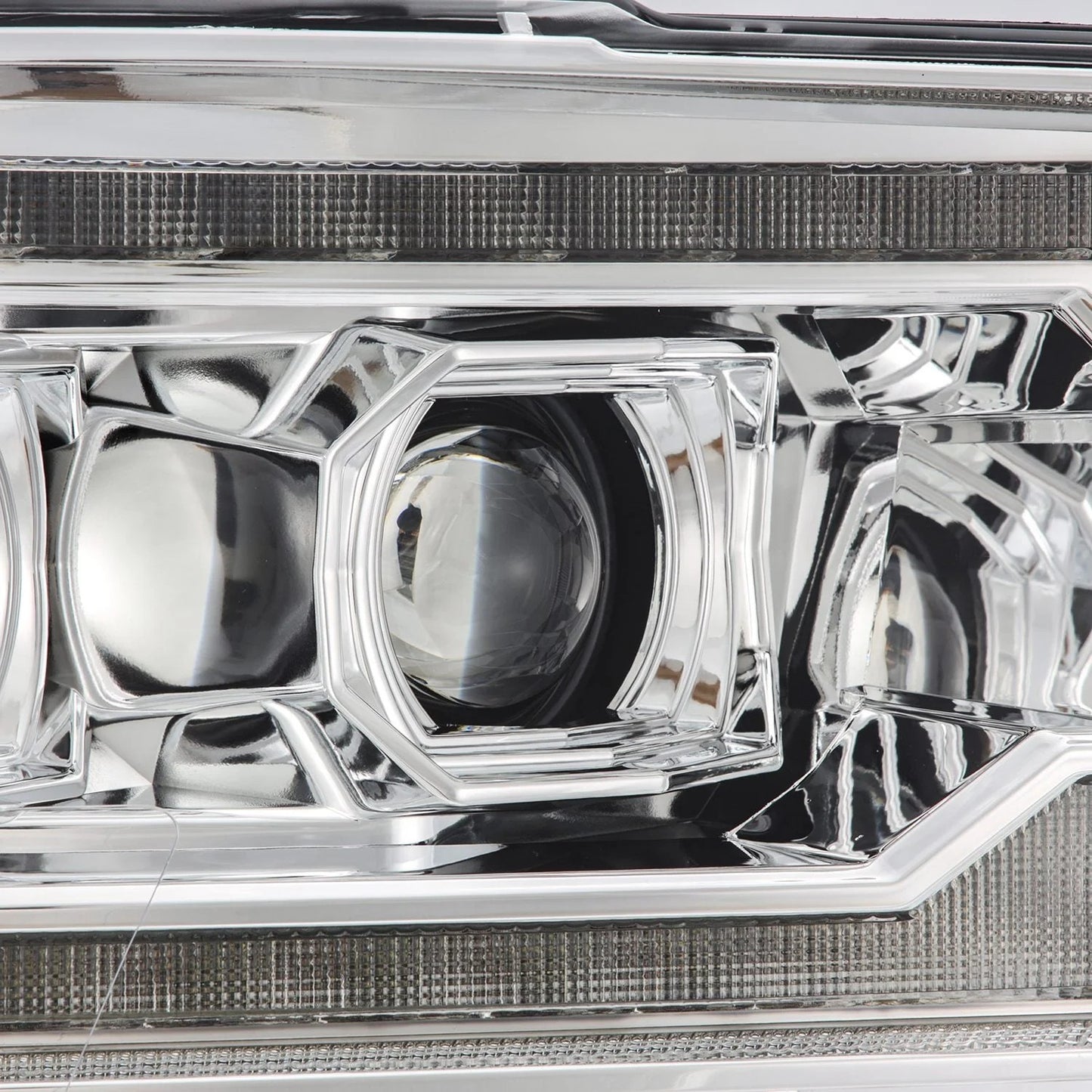 AlphaRex Chrome Plank Style Halogen Projector Headlights w/ Sequential Signal & Top Middle DRL for 2009-2018 Ram 1500 & 2019-2024 Ram 1500 Classic (SKU ARX880562 / AHL-DR09-G5-P-S-C)