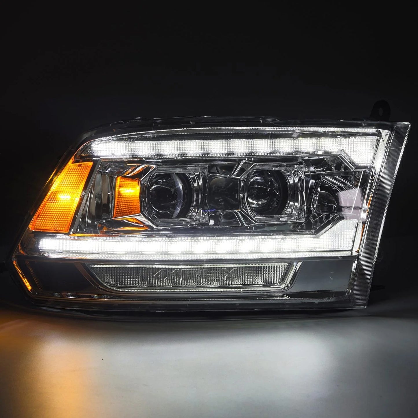 AlphaRex Chrome Plank Style Halogen Projector Headlights w/ Sequential Signal & Top Middle DRL for 2009-2018 Ram 1500 & 2019-2024 Ram 1500 Classic (SKU ARX880562 / AHL-DR09-G5-P-S-C)
